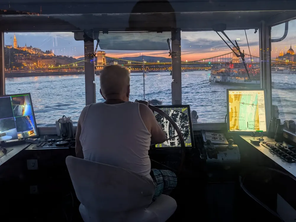 at the helm